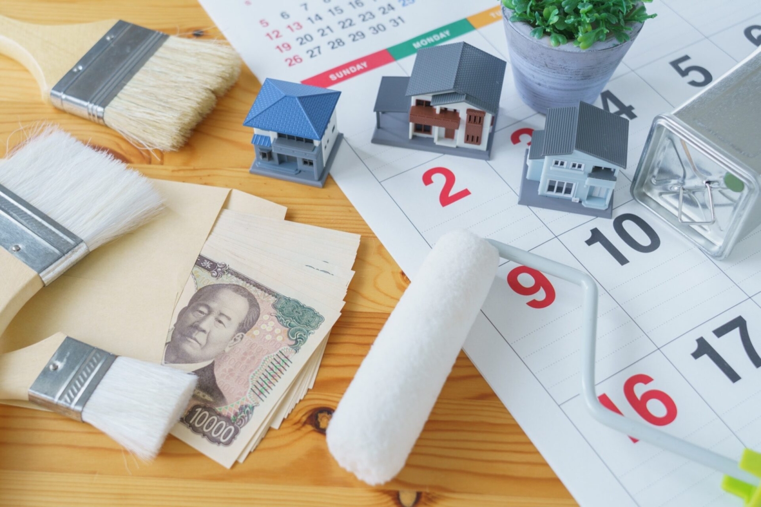カレンダーと塗装道具とお金